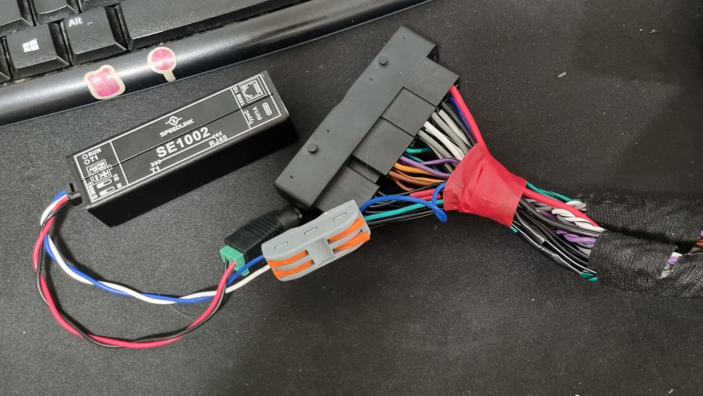 The adapter harness with two wires spliced and connected to the Automotive Ethernet adapter